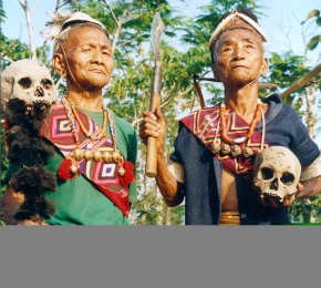 Konyak Headhunters of yore staging a headhunting incident, Longmein Village, Nagaland, 2001